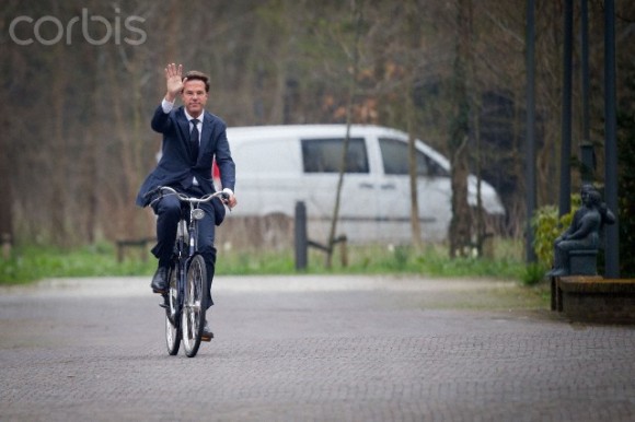 Dutch Prime Minister Mark Rutte arrives on his bicycle